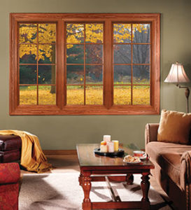 Large, wood windows looking out onto an autumn day.